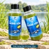Hai chai Nước Hương Cốm SH Group 100ml, một chai đứng và một chai nghiêng khoảng 30 độ, kèm cốc dung dịch cùng màu.