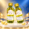 Tinh Mùi Bơ Sữa The One 60ml 3 Tinh mùi bơ sữa The One 60ml, hai chai, một đứng và một nghiêng trên nền studio với họa tiết gợi phong cách Thái.