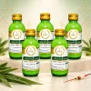 Năm chai tinh mùi kem lá dứa The One 60ml xếp hai hàng trên nền ngà có họa tiết Thái.